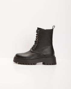 Comfort and style go hand in hand in this utilitarian inspired Frances Side Zip Combat Boots; perfect for the colder seasons or as a statement piece for your next festival or fall event. NOT ELIGIBLE FOR DISCOUNT. Heel Height: 1.95 Material: Upper: 100% PU Lining:100% Polyester Outsole: Thermoplastic PU Utilitarian Ankle Boot Chunky Rubber Sole Hook Style Laces Inner Side Zipper Closure Silver Hardware Closed Round Toe Winter Concert High Ankle Platform Boots, Winter High Ankle Platform Boots For Concerts, Trendy Winter Workwear Lace-up Boots, Trendy Winter Lace-up Boots For Concert, Edgy Winter Platform Boots For Concerts, Edgy Winter Combat Boots, Edgy High Ankle Lace-up Boots For Outdoor, Punk Style Lace-up Boots For Concerts In Winter, Fall Combat Boots With Round Toe For Concerts