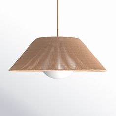 a light hanging from a ceiling fixture with a white ball in the middle and a beige shade on top