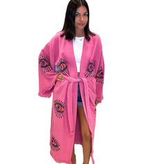 Add some bold color to your wardrobe with the Eye Kimono in hot pink. a vibrant and eye-catching piece for your summer wardrobe. Featuring a playful multi-eye print and a flowing silhouette, this kaftan exudes laid-back charm and effortless style. Shown with shorts, but also great for a beach cover up, and robe. Shop more Kimonos Hot pink One size Kimono Long sleeves Tie waist Fringe detail Lightweight Soft Handmade 100% organic cotton Pink Vibrant Print Kaftan For Vacation, Pink Vibrant Print Beach Kaftan, Pink Beach Kaftan With Vibrant Print, Pink Vibrant Print Kaftan For The Beach, Pink Printed Festival Kaftan, Pink Kaftan With Vibrant Print For Beach, Pink Printed Kaftan For Beach Season, Pink Vibrant Print Kaftan For Summer, Pink Printed Kaftan For Vacation