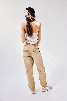 Forever classic and academia-inspired, these classic chino pants will be a go-to from this season to the next. **Fit:** Low-slung, classic slim straight fit **Features:** Zip fly and button closure, four-pocket design, soft-washed cotton, button detailing at the hem for convertible length **Why We ❤ It:** Off-duty with sporty sneakers or sleek with ballet flats, this pair has endless ways to wear. | Cleo Washed Chino by Free People in Tan, Size: US 4 Classic Fitted Pants With Cargo Pockets, Fitted Straight Leg Cargo Pants, Spring Straight Leg Chino Cotton Twill Work Pants, Spring Straight Leg Chino Cotton Twill Cargo Pants, Spring Straight Leg Chino Jeans, Straight Leg Chinos With Cargo Pockets, Straight Leg Work Pants With Five Pockets For Spring, Spring Work Pants With Five Pockets And Straight Leg, Free People Summer