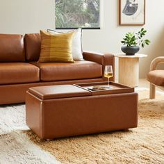 a living room filled with furniture and a coffee table on top of a shaggy rug