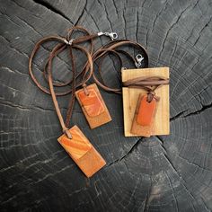 Natural Stone Pendant Necklace paired with native Texas Pecan wood. All natural, hand polished and shaped materials sourced for West Texas river stones and salvaged wood. As unique and beautiful as Texas. Each river stone and wood pairing is hung from deerskin leather and finished with a sterling silver lobster clasp. Preserve a part of Texas when you purchase our products. A wearable a bit of Texas' history to fit every occasion. Adjustable Natural Wood Necklace Nature-inspired, Earthy Natural Wood Jewelry For Gifts, Rustic Brown Healing Necklace, Earthy Brown Waxed Cord Necklaces, Brown Necklace With Natural Variations For Gifts, Earthy Brown Waxed Cord Necklace, Nature-inspired Brown Necklaces With Natural Variations, Nature-inspired Brown Necklace With Natural Variations, Brown Leather Necklace For Gifts