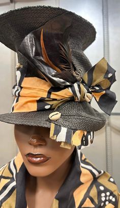 A touch of the Zulu Tribe . This is a tall hat that is sure to attract attention . It is raising the bar. It has african fabrics, leather , feathers and cowrie Shells. For more designs visit Evelyncreationinc @ etsy.com Do t delay order yours today. Bohemian Fitted Fedora Sun Hat, Bohemian Fitted Sun Hat With Short Brim, Fitted Bohemian Sun Hat With Short Brim, Adjustable Brimmed Bohemian Cloche Hat, Bohemian Wide Brim Cloche Hat, Fitted Bohemian Straw Hat With Short Brim, Black Bohemian Hat Bands For Vacation, Unique Black Adjustable Costume Hats And Headpieces, Unique Adjustable Black Costume Hats And Headpieces