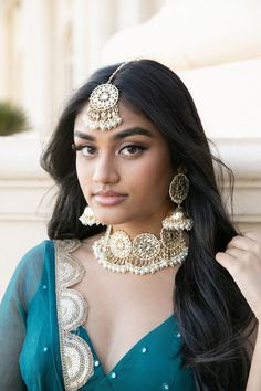 The Deepika Jewelry set is a showstopper piece. Featuring High-Quality Kundan on Gold-Plating, this beauty is sure to turn heads this Festive Season. Specifications Materials used: Kundan, pearls, gold plating At Romikas, we pride ourselves on the craftsmanship and high quality of our jewelry, designed to enhance your natural beauty. Please contact us with any questions. Festive Jewelry Sets With Latkans For Eid, Diwali Gold Kundan Anarkali Set, Diwali Gold Anarkali Set With Kundan, Gold Meenakari Anarkali Set For Diwali, Gold Anarkali Set With Meenakari For Diwali, Festive Gold Anarkali Set With Meenakari Details, Bollywood Style Festive Jewelry Sets With Latkans, Bollywood Kundan Jewelry Sets With Latkans, Gold Kundan Bollywood Tikka