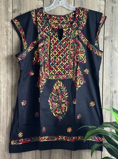 "Black Chikankari pure cotton kurta blouse. Hand embroidered  Length : 31 inches \"Embroidery designs may vary\"" Black Tops With Resham Embroidery For Festivals, Black Cotton Top With Chikankari Embroidery, Bohemian Tops With Floral Embroidery For Navratri, Multicolor Cotton Straight Kurta Top, Cotton Kurta With Floral Embroidery And Short Sleeve, Resham Embroidered Straight Kurta Tops For Festivals, Straight Kurta Tops With Resham Embroidery For Festivals, Festive Straight Kurta Top With Embroidery, Short Sleeve Cotton Kurta With Floral Embroidery