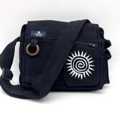 Puzzlestack’s Lukla Black Embroidered Messenger Bag Is A Compact Yet Voluminous Bag. Along With Its Multiple Pockets Used For Storage, It Includes A Large Flap Closure With Velcro. Starting Off With The Two Front Pockets, Open Up The Flap To Find The Main Compartment Following The Large Extra Pocket, And Even A Cute Mini Side Pocket! Make Travel Hands-Free With This Spacious Bag. Express Yourself With 5 Different Hand Embroidered With Thread Designs To Choose From! Not Only Is This Bag Sustainab Black Embroidered Satchel Shoulder Bag, Black Embroidered Travel Bag, Embroidered Black Shoulder Bag For Travel, Black Embroidered Bag For Daily Use, Black Embroidered Satchel For Daily Use, Black Embroidered Bags For Daily Use, Black Embroidered Rectangular Shoulder Bag, Casual Black Embroidered Bag, Embroidered Black Satchel Shoulder Bag