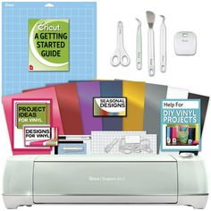 the cricut machine is set up with all its accessories and instructions on it