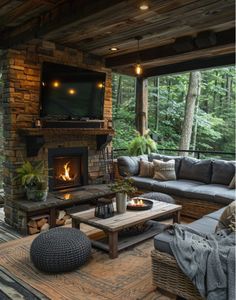 a living room filled with furniture and a flat screen tv mounted on the wall above a fire place