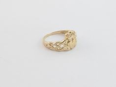 14k Solid Yellow Gold Irish Claddagh Ring!! Material: 14k gold , Not plated or filled Metal Purity: 14k gold , Stamped Ring weight: 2.4 grams Ring size: Available from size 5 to 8 Finish: Shiny puffed heart Complementary Gift Box Images may be enlarged to show detail and the item may look larger than it appears in person.In order to reduce buyer remorse and return please pay attention to the photos and read description to make sure about measurements such as size , thickness, and length before t 14k Gold Heart Ring In Fine Jewelry Style, Gold 14k Heart Ring In Fine Jewelry Style, Yellow Gold Round Heart Ring, Tarnish Resistant, Classic Heart Ring In Yellow Gold With Diamond Cut, Classic Yellow Gold Heart Ring With Diamond Cut, Yellow Gold Heart Ring Tarnish Resistant, Gold Stackable Rings Hallmarked 14k, Hallmarked Gold Heart Ring, Gold Hallmarked Heart Ring In 14k Gold