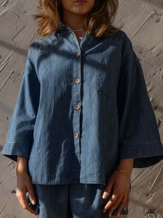 Meet our best-selling Linen Shirt, now in soft, denim chambray! This relaxed-fit button down-shirt for women has wide sleeves and a boxy fit that makes it the perfect everyday piece for the warm weather. We love it paired with The Chambray Denim Short or The Wide Leg Jean.Our small-batch wash process means that each of our denim garments will vary slightly in color and appearance.• Composition: 100% cotton• Available in: MID DENIM• US sizes: XS (US 0–2), S (US 4–6), M (US 8–10), L (US 12–14), XL Washed Blue Chambray Button-up Denim Top, Oversized Dark Wash Shirt For Spring, Denim Blue Denim Top With Button Cuffs, Trendy Washed Blue Shirt For Everyday, Everyday Chambray Button-up Tops, Trendy Denim Blue Shirt For Everyday, Trendy Everyday Denim Blue Shirt, Summer Relaxed Fit Button-up Denim Jacket, Relaxed Fit Washed Blue Denim Jacket For Summer