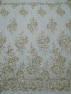 "This stunning Lace Fabric design piece has soft hand feel, It's perfect for weddings, bridal parties, and any events. Shop our large inventory of bridal fabrics. ☆PRODUCT DESCRIPTION : This gorgeous fabric is made on a sheer base with a beautiful vintage embroidery and delicate beaded throughout. The fabric width is approximately 51\" (130cm) Wide. Color: light champagne as in picture Material: Rayon, Polyester，Sequins, Pearls ☆ PURCHASING INFORMATION: This fabric is sold by the yard and each Q Elegant Rhinestone Embroidered Fabric For Weddings, Elegant Embroidered Fabric With Rhinestones For Wedding, Elegant Embroidered Sequin Fabric For Wedding, Elegant Cream Sequin Fabric With Pearl Embroidery, Elegant Wedding Sequin Fabric With Pearl Embroidery, Elegant Cream Embroidered Fabric With Sequins, Glamorous Sequin Fabric With Intricate Embroidery For Wedding, Party Pearl Embroidered Cream Fabric, Cream Pearl Embroidered Fabric For Party