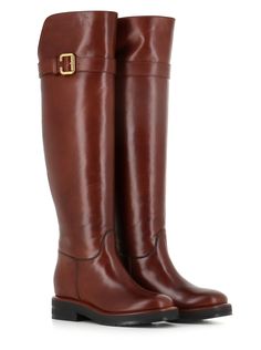 Cognac soft leather women's over-the-knee Boot by Chloè, featuring by an oversized strap with a gold-coloured buckle. Serrated rubber sole. Lined interior. internal rise. Heel: 5 cm Leg height: 49 cm Circumference: 40 cmComposition: Leather Luxury Calf Leather Knee-high Boots For Business, Luxury Knee-high Boots With Leather Sole For Business, Luxury Knee-high Calf Leather Boots With Leather Sole, Luxury Calf Leather Knee-high Boots, Classic Calf Leather Knee-high Boots With Leather Sole, Classic Knee-high Boots With Calf Leather, Luxury Leather-lined Knee-high Boots For Work, Luxury Knee-high Boots With Leather Lining For Work, Luxury Knee-high Boots With Leather Sole