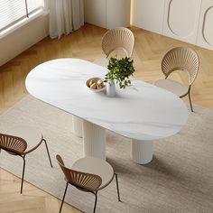 a white table with four chairs around it