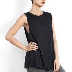 Effortless black top for women made from certified organic cotton. To see our entire collection of sustainable, low impact, slow fashion visit our shop https://www.etsy.com/shop/eleven44 It is a loose fitting, sleeveless tshirt with high quality stitching, extra binding around the neckline and armholes so it will keep its shape over time. Available in 3 easy fit sizes. The length from the shoulder to the hem is: Small - 74 cm.  Medium - 76 cm. Large - 78 cm. The width is: Small - 48 cm. Medium - 51 cm Large - 54 cm. Versatile Black T-shirt For Summer, Black Relaxed Fit Tank Muscle Tee, Relaxed Fit Black Muscle Tank Tee, Casual Black Tank Top With Dropped Armholes, Black Summer Tops For Everyday, Black Everyday Summer Tops, Black Sleeveless Top With Relaxed Fit, Black Relaxed Fit Muscle Tee For Everyday, Black Cotton Muscle Tee For Layering