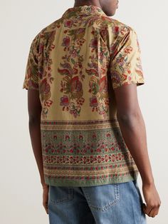 Kardo employs heritage weaving, dyeing and printing techniques so every item of clothing is a true celebration of craftsmanship. This 'Chintan' shirt is made from cotton that's patterned with ornate florals and a wallpaper-like border. The label uses only natural pigments throughout its collections. Responsible Craftsmanship. This product promotes artisanal skill and brands that invest in communities and adhere to fair-trade principles. Find out more about our Consciously Crafted criteria here. Patterned Cotton Camp Shirt With Vintage Print, Vintage Printed Cotton Camp Shirt, Vintage Floral Print Collared Camp Shirt, Brown Vintage Print Collared Shirt, Mens Floral Rayon Shirt, Cotton Shirts For Men, Suede Jacket, Formal Shirts, Wardrobe Essentials