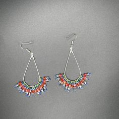 Dangle earrings dance with beads and crystals. The colors reminded me of a sparkling carrot patch with extra pizzazz! Each piece of jewelry listed at Je Suis Courtenay is handmade with supplies sourced by me, and each is a one of a kind unique item. These will not be restocked! If you love to stand out you're in the right place. Nickel-free Multicolor Teardrop Crystal Earrings, Multicolor Metal Dangle Crystal Earrings, Adjustable Teardrop Crystal Earrings With Dangling Beads, Multicolor Beaded Dangle Crystal Earrings, Multicolor Metal Earrings With Dangling Beads, Multicolor Nickel-free Dangle Crystal Earrings, Multicolor Nickel Free Dangle Crystal Earrings, Colorful Beaded Metal Drop Earrings, Multicolor Beaded Metal Earrings With Ear Wire