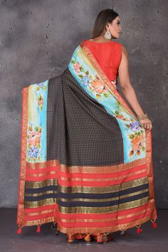 Look your ethnic best on festive occasions in this beautiful black zari check Mysore silk saree! The saree has a blue printed zari border. It comes with a matching blouse piece. Shop designer sarees in USA from Pure Elegance. Disclaimer: The shown stitched blouse on the model is for display purpose only. The saree comes with a matching blouse piece and finished with fall and piko. Black Cotton Silk Pre-draped Saree For Diwali, Black Cotton Silk Pre-draped Saree With Zari Work, Navratri Black Cotton Silk Traditional Wear, Black Cotton Silk Traditional Wear For Navratri, Black Silk Handloom Pre-draped Saree, Black Silk Pre-draped Saree With Zari Weaving, Black Chanderi Saree For Navratri, Festive Black Cotton Silk Saree, Festive Black Cotton Silk Pre-draped Saree