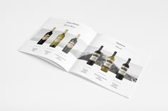 an open wine bottle brochure on a white surface