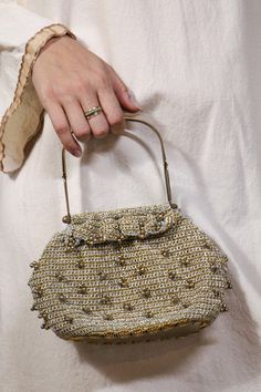 "Adorable beaded crochet handbag, has bronze metal structured straps. Clear bottom. Very cute and perfect for a glimmering night out. 9\" wide 5\" long" Elegant Crochet Bag With Gold-tone Hardware, Elegant Beaded Crochet Bag, Elegant Everyday Beaded Crochet Bag, Gold Beaded Clutch For Everyday Use, Glamorous Gold Beaded Shoulder Bag, Chic Gold Crochet Evening Bag, Vintage Embellished Bag As Fashion Accessory, Vintage Embellished Evening Bag, Gold Evening Bag With Handles