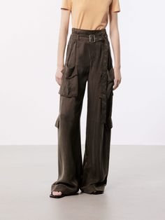 MO&Co. Women's Wide Leg Cargo Pants These pants are made from sustainable and eco-friendly materials, featuring a wide-leg and cargo style making them a fashionable and practical choice for a casual or streetwear look. The wide pocket design adds functionality and versatility, perfect for carrying essentials while on the go, and the belt ensures a secure fit and adds an extra touch of style. The brown pants may appear olive or khaki under different lighting. Features : - Wide leg in cargo style, Wide Leg Cargo Pants, Cargo Style, Brown Pants, Pocket Design, Cargo Pants, The Go, Carry On, Wide Leg, Eco Friendly