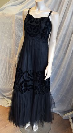 "1940's Black Mesh Gown with Velvet Applique 36\" bust 32\" waist. A beautiful flouncy gown made from a fine black mesh, lined in black. The dress has narrow straps, fitted upper bodice with a lovely black velvet applique design. The bodice is actually quit short almost like an empire line see measurements below. With this in mind I have measured at the natural waist as well as at the bodice seam The skirts flare towards a deep tiered hemline that is gathered onto the lower skirt giving lots of Velvet Applique, Mesh Gown, Prom 2022, Crepe Dress, Knit Skirt, Vintage Clothes, Applique Designs, Black Mesh, Linen Dress