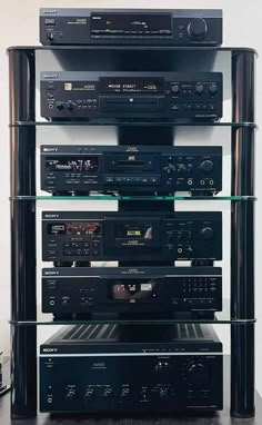 a stack of stereo equipment sitting on top of each other