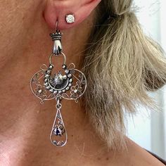 A delicate and whimsical design for these fillagree silver earrings. Classic motifs with Mexican hand and bird milagros. Layers of fillagree swirls, flowers, and hand engraved detail end with an amethyst drop.  A lightweight lacy statement chandelier earring! Metal - sterling silver marked 925 with makers mark MG - 44, they were made in Mexico City Gem - Amethyst Earrings are 70mm or 2 3/4 inch long from top of hook to bottom of drop, and 32mm, at widest point *The pictures are part of the descr Chandelier Earring, Statement Chandelier, Statement Chandeliers, Earrings Classic, Whimsical Design, Coral Beads, Amethyst Earrings, I Love Jewelry, Dublin Ireland