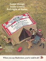 an advertisement for budweiser beer with people standing around a tent and camping equipment