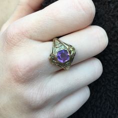 Details: Victorian 14K gold Art Deco amethyst ring circa 1930's. Beautiful deco design, with leaf inspired pattern. The lovely amethyst measures 6.7mm x 6.7mm, and sits about 5.5mm from the finger. The setting measures 15.4mm from top to bottom. The ring is in excellent condition. Please ask all necessary questions prior to placing an order. Measurements: The size is 7 US and can be sized for a fee. Condition: The overall all condition of this ring is excellent condition and the stone is securel Antique 14k Gold Amethyst Ring, Art Deco Purple Amethyst Ring For Formal Occasions, Purple Amethyst Art Deco Ring For Formal Occasions, Formal Art Deco Purple Amethyst Ring, Art Deco Amethyst Ring In Yellow Gold, Art Deco Yellow Gold Amethyst Ring, Yellow Gold Amethyst Ring In Art Deco Style, Purple Hallmarked Art Deco Amethyst Ring, Art Deco Purple Amethyst Ring