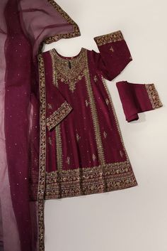 A beautiful festive look in the captivating shade of eggplant purple, crafted on pure raw silk, heavily embellished with gold & antique zardozi craftsmanship, each stitch is a testament to generations of artistry. Completing this masterpiece of a design is a gorgeous fully embellished soft pure tissue shawl, alongs Traditional Purple Sharara For Festive Occasions, Traditional Purple Sharara With Drape, Traditional Purple Sharara With Traditional Drape, Purple Silk Sharara With Dupatta, Purple Bollywood Raw Silk Sharara, Bollywood Style Purple Raw Silk Sharara, Bollywood Purple Raw Silk Sharara, Elegant Semi-stitched Purple Embroidered Fabric, Traditional Purple Sharara With Dupatta