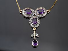 ANTIQUE GOLD AMETHYST AND FAUX DIAMOND PENDANT: Edwardian lavalier pendant FREE SHIPPING. See specifications below. Please read condition section before buying. This beautiful antique Edwardian / Victorian pendant necklace has three oval Amethysts made of paste glass set into a bezel silver setting. Each has a faux diamond border with clear paste glass set in silver. All is set into a 9ct / 9k gold frame and hangs on a stamped 9ct gold chain with extender. The pendant also has a long gold drop p Vintage Drop Necklaces For Gifts, Vintage Drop Necklaces For Gift, Purple Art Deco Necklace For Gift, Vintage Teardrop Gemstone Pendant Necklace, Vintage Teardrop Pendant Gemstone Necklace, Vintage Gemstone Teardrop Pendant Necklace, Victorian Purple Necklace For Anniversary, Vintage Purple Pendant Necklace, Vintage Amethyst Yellow Gold Necklace