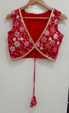 This Made to Order/Made to Measurement/Custom Made Indian Ethnic Blouse. - Fabric - Embroidered Georgette - Color  Red color - Princess Cut - Rich Lined - Shoulder string with latkans - Sleeveless - Extra margin and extra stitches included in the blouse - It can be customize in any color, design or size  MEAUREMENTS & CUSTOMIZATIONS This blouse can be purchased in your standard sizing and pattern. Please choose your Chest Size (measured in inches) from the drop-down box.. For custom sizing pleas Traditional Sleeveless Lehenga With Mirror Work, Embroidered V-neck Traditional Wear For Festivals, Red Sleeveless Bollywood Style Sets, Red Sleeveless Bollywood Set, Red Sleeveless Zari Work Set, Traditional Sleeveless Sets With Mirror Work, Sleeveless Anarkali With Mirror Work, Sleeveless Red Lehenga For Diwali, Sleeveless Red Sets With Zari Work