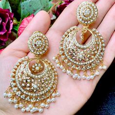 Featuring a pair of intricately handcrafted jadau chandbali earrings in 22k gold plated sterling silver. The earrings are embellished with over 350 handset precious freshwater pearls. The hanging beads are freshwater pearls. The earrings weigh 32 gms and measure 7cms x 4cms Watch Video Here Pearl Earrings Drop, 22k Gold Jewelry Necklaces, 22k Gold Jewelry, Hanging Beads, Chandbali Earrings, Pearl Necklace Set, Gold Jewelry Necklace, Emerald Necklace, Gold Bangle Bracelet