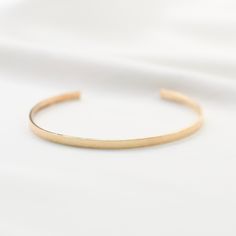 "14K gold cuff bracelet. 14K Gold Minimalist Cuff Bracelet * 14K solid gold. It is about 3mm x 1mm Please select the size of your wrist. If your wrist is 6\", please purchase 6\" bracelet. (If you order a 6\" bracelet, actual cuff length will be 5\" plus 1 inch opening.) Please read our policies before you place your order. https://www.etsy.com/shop/SashJewelry/policy?ref=shopinfo_policies_leftnav To see other Mother daughter necklace set click here: https://www.etsy.com/shop/SashJewelry?section Adjustable Minimalist Gold Bracelet With Polished Finish, Minimalist Open Cuff Bracelet, Minimalist Open Cuff Bangle For Everyday, Minimalist Stackable Gold Bangle Bracelet, Minimalist 14k Gold Cuff Bracelet Gift, Minimalist Yellow Gold Cuff Bracelet For Formal Occasions, Minimalist Stackable Cuff Bangle Bracelet, Minimalist Stackable Cuff Bangle, Adjustable Yellow Gold Minimalist Cuff Bracelet