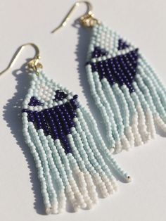 Classic beaded drape earrings with tones of ocean and sky 🌊 Fair trade Handcrafted in India Glass beads Hypoallergenic & nickel free Measures 2.75" in length Blue Large Beads Dangle Earrings, Blue Large Beaded Dangle Earrings, Blue Beaded Drop Earrings With Large Beads, Blue Large Beads Drop Earrings, Blue Large Beaded Drop Earrings, Bohemian Blue Long Drop Beaded Earrings, Adjustable Blue Earrings With Large Beads, Adjustable Blue Beaded Chandelier Earrings, Blue Dangle Chandelier Earrings For Summer