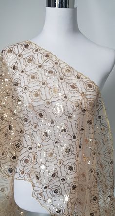 Gold net shawl with floral pattern made with gold sequins embroidery. Very elegant.  Gift it or keep it.  Size is approximate  194cm Length 40cm Width  Monitor colour is not accurate. Luxury Gold Dupatta Shawl, Festive Gold Sequined Dupatta, Gold Dupatta With Resham Embroidery For Reception, Festive Gold Embellished Dupatta, Gold Embroidered Fabric For Party With Traditional Drape, Gold Dupatta With Sequins In Traditional Drape, Gold Embellished Dupatta For Reception, Gold Embellished Bollywood Dupatta, Festive Gold Dupatta With Intricate Embroidery