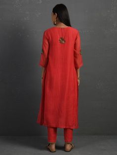 A straight-cut kurta in cotton silk fabric with all-over floral buttis made using beads, sequins and silk French knots. Kurta, pants and dupatta have lace edging at the hem, side cut, and sleeve ends. Beadwork runs along the neckline and in between lace patterns. Delicate pin tucks stitched across the organza dupatta with embroidered scalloped edges and machine stitches in between pin tucks. Elasticated waist comfortable fully lined pants with drawstrings. Kurta measurements (in Inches): Size S: Cotton Silk Palazzo Set With Embroidered Border For Diwali, Diwali Cotton Silk Palazzo Set With Embroidered Border, Slub Silk Straight Kurta With Embroidered Border, Straight Kurta Churidar With Intricate Embroidery In Slub Silk, Slub Silk Set With Floral Embroidery And Straight Kurta, Slub Silk Churidar With Intricate Embroidery, Traditional Tussar Silk Palazzo Set With Embroidered Border, Bollywood Style Tussar Silk Palazzo Set With Embroidered Border, Transitional Slub Silk Sets With Embroidered Border