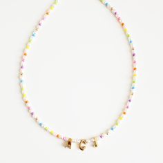 Dress in elegance with our Personalized Rainbow Initial Necklace, featuring natural pearls and colorful seed beads. Ideal for daily wear or thoughtful gifting, this piece combines timeless beauty with a playful touch. *Personalized pieces take between 2-4 business days to ship* Handcrafted in USADETAILS: Material: Freshwater pearls, gold-filled clasp, stainless steel letters Skin Friendly ALL LETTERS ARE CAPITAL-Length 15 inches + 2-inch adjustable extender chain Note: you can add more letters, Necklaces Pearl, Letter Symbols, Initial Necklaces, Rainbow Necklace, Letter Beads, Gold Letters, Letter Necklace, Oils For Skin, Gold Filled Jewelry