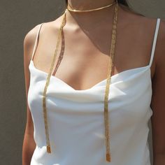 One of Camille's personal favorites! Not only is this style ultra versatile...could be worn 4 different ways!!! This scarf chain necklace looks spectacular worn alone or layered up! The Anuket versatile scarf chain necklace comes in a half hard collar with 10 strands of our signature faceted tubular design chain. Brass base 18K gold plated 4mm half hard round collar with caps: Size: 5 3/4" W x 3 3/4" H Tube design end caps. Size: 2.4mm x 19mm Delicate faceted tube chains Customize look up to fou Gold Fashion Jewelry, Gold Scarf, Collar Scarf, Tube Design, Chain Necklace Gold, Scarf Necklace, Chain Design, Gold Jewelry Fashion, Jewelry Online