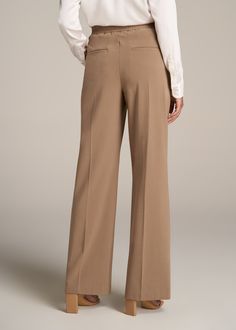 About Our Flat Front Wide Leg Dress Pants for Tall Women Ultra-flattering and easy to wear, these women's tall dress pants are a closet essential. They feature a smooth front with a contoured waistband for a complimentary finish. Pleated accents at the front and back elongate your legs and make them easy to wear from the desk to dinner. Built with a stretch-infused polyester-viscose blend, these pants for tall women offer the sleek feel of a suit with the comfort of a lounge pant. An elastic at Elegant Ankle-length Dress Pants With 4-way Stretch, Elegant Ankle-length 4-way Stretch Dress Pants, Elegant 4-way Stretch Ankle-length Dress Pants, Loosely Fitted Full Length Solid Dress Pants, Versatile Formal Dress Pants For Spring, Versatile Tailored Full-length Dress Pants, Tailored Full Length Versatile Pants, Tailored Full-length Versatile Pants, Elastane Wide Leg Pants For Work