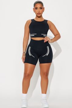 Available In Black. Active Top Scoop Neck Sleeveless Padded Cropped Active Biker Short High Waisted, Elastic Waistband Elevate Reflective Detail High Performance Stretch Body: 73% Polyester 27% Spandex Inner Mesh: 82% Nylon 18% Spandex Imported | Sprint Reflective Elevate Active Set in Black size XS by Fashion Nova Black Compression Tank Top With Built-in Bra, Fitted Short Sportswear Tops, Fitted Short Length Sportswear Tops, Fitted Short-length Sportswear Tops, Fitted Short-length Sports Top, Sporty Short Tank Top For Workout, Black Compressive Activewear For Summer, Compressive Black Activewear For Summer, Sleeveless Black Seamless Activewear