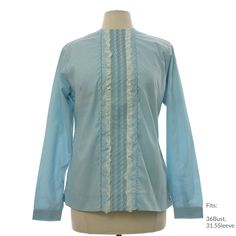 Early 60s "H Bar C California Ranchwear, Made in USA" Womens light blue background polyester cotton broadcloth with darker blue zigzag embroidery on center front panel with white lace and smocking, longsleeve Mod shirt with back zipper closure, round neckline, back shaped yoke, snap cuffs, square hemline with short side slits, deadstock with original tag Fits: 36Bust, 31.5Sleeve Our item # 367456-M63772 Light Blue Long Sleeve Blouse For Daywear, Light Blue Long Sleeve Shirt For Daytime, Light Blue Long Sleeve Tops For Daywear, Blue Long Sleeve Ruffled Shirt, Fitted Long Sleeve Light Blue Blouse, Fitted Light Blue Shirt For Spring, Light Blue Fitted Shirt For Spring, Light Blue Cotton Blouse For Daywear, Light Blue Fitted Shirt For Daywear