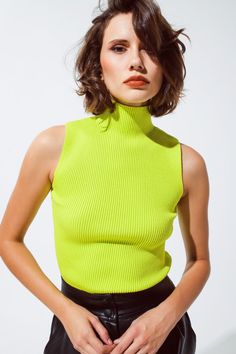 Introducing our Knitted Lime Green Top with a Chic High Neck and Sleeveless Design – a stylish and versatile addition to your wardrobe, perfect for creating fashionable outfits.   Key Features:     Material:  Crafted from a blend of 55% Viscose and 45% Polyamide, this lime green top offers a fine and comfortable knit.   Sleeveless Design:  This top features a sleeveless style, making it versatile for layering under blazers or cardigans.   High Neck:  The high neck adds a touch of elegance and style to your outfit.   Bodycon Fit:  Designed for a body-hugging fit, it enhances your silhouette for a chic and fashionable look.   Turtleneck Neckline:  The turtleneck neckline adds warmth and style to your ensemble, suitable for various occasions.   Fit:  Model is wearing size S. Model is: 32-23-3 Top Without Sleeves, Lime Green Top, Sleeveless Turtleneck Top, Verde Lima, Sleeveless Knit Top, Sleeveless Turtleneck, Sleeveless Knit, Turtleneck Top, Fashionable Outfits