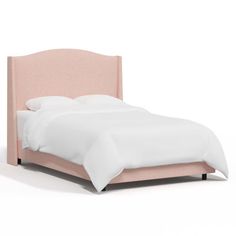 a bed with a pink headboard and white sheets on it's side, in front of a white background