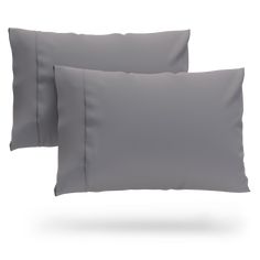 two grey pillow cases sitting next to each other