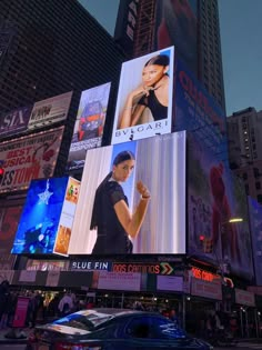 a large billboard on the side of a building in times square, new york city