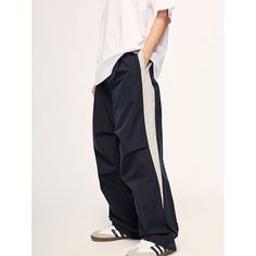 Loose Retro Color-Block Sports Wide-Leg Pants Material: 100%Polyester Size: S, M, L, XL Color: Navy Blue, Purple Applicable Scene: Leisure, Daily, Vacation Casual Cotton Pants With Contrast Color, Streetwear Bottoms With Contrast Color And Long Pants, Stretch Pants With Contrast Color For Streetwear, Sportswear Wide Leg Parachute Pants With Pockets, Sportswear Parachute Pants With Pockets, Blue Workout Bottoms With Elastic Side Panels, Navy Sportswear Sweatpants With Pockets, Navy Relaxed Fit Joggers For Streetwear, Navy Sweatpants With Pockets For Sportswear