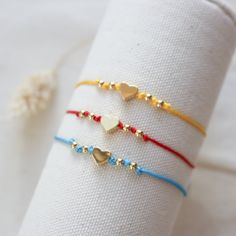 M A T E R I A L S:• Beads 18K Gold Plated• Cotton cord………………………………….SIZE• Heart: 6mm• Beads: 3.2mm aprox• Bracelet is adjustable 8 -12 ft Dainty Heart Friendship Bracelets, Minimalist Heart Friendship Bracelets For Everyday, Heart-shaped Adjustable Friendship Bracelets, Everyday Heart-shaped Friendship Bracelets With Adjustable Cord, Cute Heart-shaped Friendship Bracelets For Everyday, Handmade Adjustable Minimalist Heart Bracelet, Heart-shaped Friendship Bracelets With Sliding Knot, Handmade Heart Friendship Bracelet, Dainty Handmade Heart Friendship Bracelets