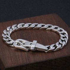 Men's Sterling Silver Belt Buckle Curb Chain Bracelet A perfect blend of elegance and innovation with its unique belt buckle clasp. Crafted from premium sterling silver, this versatile piece complements both formal and casual outfits, elevating your style effortlessly. Product Details Metal Type: 925 Sterling Silver Gender: For Men Style: Punk Width: 9 mm Thickness: 3 mm Length: 19 cm / 20 cm / 21 cm Weight: 37.5 g / 39.4 g / 41.3 g Adjustable Chain Link Sterling Silver Bracelet For Formal Occasions, Elegant Formal Chain Bracelet, Classic Sterling Silver Bracelet With Silver Chain, Luxury Chain Bracelet With Clasp For Formal Occasions, Luxury Chain Bracelet With Clasp For Formal Events, Elegant Silver Chain Link Bracelets, Elegant Adjustable Chain Bracelet With Sterling Silver Clasp, Luxury Sterling Silver Chain Bracelet For Formal Events, Luxury Sterling Silver Bracelet For Everyday