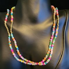 Brand New, Gold Tone, Rice Beads, Shell On Clasp, 34 Inches Long. Multicolor Double Strand Beaded Necklaces, Multicolor Double Strand Beaded Necklace With Large Beads, Multicolor Double Strand Necklace With Large Beads, Multicolor Double Strand Jewelry With Tiny Beads, Multicolor Double Strand Beaded Necklace For Beach, Adjustable Multicolor Double Strand Beaded Necklaces, Multicolor Double Strand Beaded Necklace, Trendy Multicolor Heishi Beads Jewelry, Multicolor Double Strand Beach Jewelry